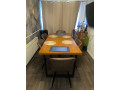 extendable-dining-table-and-four-brown-tub-chairs-small-1
