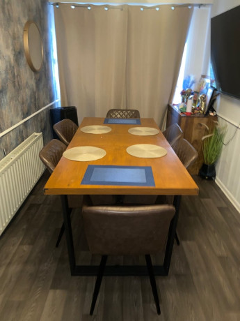 extendable-dining-table-and-four-brown-tub-chairs-big-1